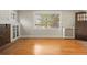 Bright living room featuring hardwood floors, fireplace, and natural light from a large window at 346 N Corona St, Denver, CO 80218