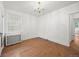 Bright living room features wood floors, white walls, with window and chandelier at 346 N Corona St, Denver, CO 80218
