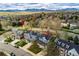An aerial view of a residential neighborhood with mountain views and nearby hiking trails at 2225 Clayton Cir, Superior, CO 80027