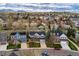 Stunning aerial view of a residential neighborhood with mountain backdrop and tree-lined streets at 2225 Clayton Cir, Superior, CO 80027