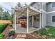 Backyard patio featuring a pergola, seating, table and lush landscaped garden at 2225 Clayton Cir, Superior, CO 80027