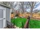 Backyard with storage shed, manicured lawn, and privacy fence at 2225 Clayton Cir, Superior, CO 80027
