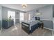 Cozy bedroom with a navy and white color scheme, featuring carpeted floors and a bright, airy ambiance at 2225 Clayton Cir, Superior, CO 80027