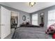 Primary bedroom offers a walk-in closet, a traditional dresser, soft lighting, and neutral-toned walls at 2225 Clayton Cir, Superior, CO 80027