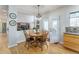 Inviting dining area offers wood flooring, a round wood table with seating, and a seamless transition into the living space at 2225 Clayton Cir, Superior, CO 80027