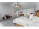 Airy main bedroom showcasing plush carpet, a ceiling fan, neutral walls, and an ensuite bathroom and walk-in closet at 2225 Clayton Cir, Superior, CO 80027