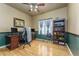 Cozy home office with hardwood floors, custom built-in shelving, and neutral color scheme at 2225 Clayton Cir, Superior, CO 80027