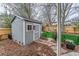 Backyard shed with small window, manicured green lawn and wrought iron fencing at 2225 Clayton Cir, Superior, CO 80027