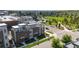 Aerial view of modern townhomes with rooftop decks, set near a green park, offering vibrant community living at 22 Oneida Ct, Denver, CO 80230