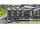 Aerial view of modern townhomes with rooftop terraces, landscaping, and street frontage at 22 Oneida Ct, Denver, CO 80230