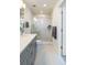 Elegant bathroom showcases walk-in shower, modern vanity, and updated fixtures with seamless glass door at 22 Oneida Ct, Denver, CO 80230