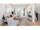 Bright living room with modern decor, including a comfortable sofa, stylish rug, and ample natural light at 22 Oneida Ct, Denver, CO 80230