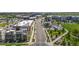 Street view showcasing modern townhomes, commercial spaces, and lush green spaces, creating a dynamic community at 22 Oneida Ct, Denver, CO 80230