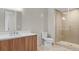 Modern bathroom boasts a walk-in shower and stylish wood vanity at 4200 W 17Th Ave # 49, Denver, CO 80204