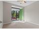 Secondary bedroom with large window and neutral color palette at 4200 W 17Th Ave # 49, Denver, CO 80204