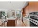 Sleek kitchen with stainless steel appliances and a large island at 4200 W 17Th Ave # 49, Denver, CO 80204