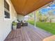 Charming covered patio with outdoor seating, perfect for enjoying the serene backyard and outdoor entertaining at 795 Moline St, Aurora, CO 80010