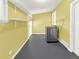 Functional laundry room with modern appliances, shelving for storage, and ample space for sorting and folding laundry at 795 Moline St, Aurora, CO 80010