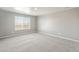 Neutral bedroom featuring carpeting and a large window at 18029 Dandy Brush Ln, Parker, CO 80134