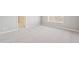 Bright bedroom featuring neutral walls, carpet, white trim, and a window offering natural light at 18029 Dandy Brush Ln, Parker, CO 80134