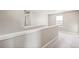 Upstairs hallway featuring neutral paint, white railings and trim at 18029 Dandy Brush Ln, Parker, CO 80134