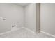 Laundry room featuring tile floors and hookups for laundry machines at 18029 Dandy Brush Ln, Parker, CO 80134