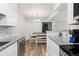 Efficient kitchen featuring granite countertops, stainless appliances, and dining area at 10150 E Virginia Ave # 104, Denver, CO 80247