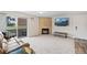 Bright living room with fireplace, modern furnishings, and access to outdoor patio at 10150 E Virginia Ave # 104, Denver, CO 80247