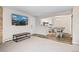 Open living area with dining space, kitchen view, and large screen TV at 10150 E Virginia Ave # 104, Denver, CO 80247