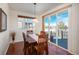 Cozy dining room with a wooden table, chairs, and sliding doors to the outdoor patio at 3211 Westbrook Ln, Highlands Ranch, CO 80129