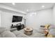 Finished basement offering a comfortable area to relax, complete with a TV area and contemporary finishes at 1888 S Filbert Ct, Denver, CO 80222