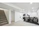 Finished basement offering a comfortable area to relax or exercise, along with nearby stairway at 1888 S Filbert Ct, Denver, CO 80222