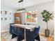 Modern dining room featuring a sleek table, stylish chairs, and contemporary lighting fixture at 1888 S Filbert Ct, Denver, CO 80222