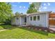 Lovely home with a well-kept yard and stone-lined garden beds at 1888 S Filbert Ct, Denver, CO 80222