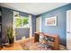 Bright home office with hardwood floors, natural light and view to the exterior at 1888 S Filbert Ct, Denver, CO 80222