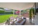 Relaxing covered patio with comfortable seating and a cozy fire pit at 1888 S Filbert Ct, Denver, CO 80222