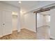 Bright bedroom with wood-look floors, closet and rustic wooden accent detail above the entry to another room at 5080 Uinta St, Denver, CO 80238