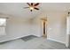 Spacious bedroom features neutral walls, a ceiling fan, and a window providing natural light at 5080 Uinta St, Denver, CO 80238