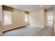 Open bonus room with carpet floors, windows with decorative shades and white trim at 5080 Uinta St, Denver, CO 80238