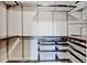 Walk in closet featuring multiple shelves and storage drawers at 5080 Uinta St, Denver, CO 80238