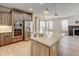 Modern kitchen with stainless steel appliances, granite countertops, and a spacious island at 5080 Uinta St, Denver, CO 80238