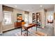 Well-lit office space with built-in shelving, a modern desk, and a comfortable chair at 5080 Uinta St, Denver, CO 80238
