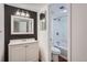 Well-maintained bathroom featuring a modern vanity, updated fixtures, and a shower-tub combo at 17652 E Loyola Dr # 2032R, Aurora, CO 80013