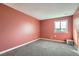 Cozy bedroom with plush carpeting and a bright window offering tranquil views at 17652 E Loyola Dr # 2032R, Aurora, CO 80013