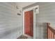Unit 2032R with attractive red door, enhancing curb appeal, and a welcoming entrance at 17652 E Loyola Dr # 2032R, Aurora, CO 80013