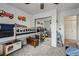 Stylish bedroom with a bunk bed, mirrored closet, and playful wall decorations at 646 S Joplin St, Aurora, CO 80017