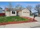 Charming single-story home featuring a well-maintained yard, solar panels, and a two-car garage at 646 S Joplin St, Aurora, CO 80017