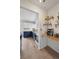 Open-concept kitchen featuring blue and white cabinetry, granite countertops, and adjacent coffee bar area at 646 S Joplin St, Aurora, CO 80017