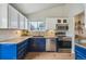 Well-appointed kitchen with stainless steel appliances, tile backsplash, and sleek cabinetry at 646 S Joplin St, Aurora, CO 80017