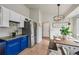 Bright kitchen with stainless steel fridge, stylish lighting, and dining area with a wooden table at 646 S Joplin St, Aurora, CO 80017